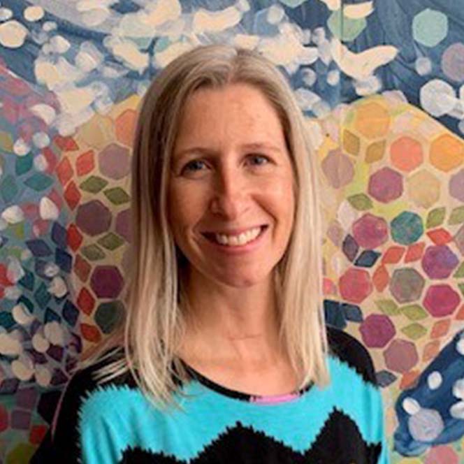 Caucasian Woman with light colored hair smiling