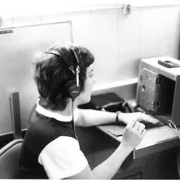 Woman taking a hearing test with headphones over her head